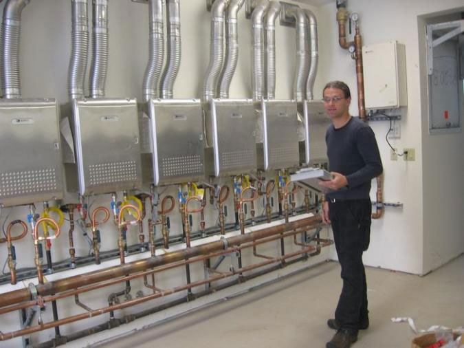 Cascading Water Heater System 3 Andy Sorter checking some final specs and running final tests.